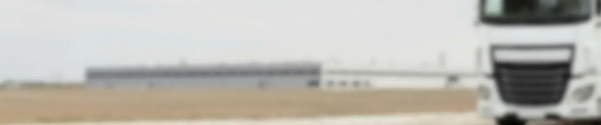 Blurred image of truck leaving the distribution centre