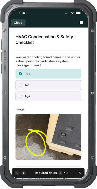 HVAC Condensation & Safety Checklist in Fluix with a flagged water pooling finding and annotated photo evidence of a drain blockage