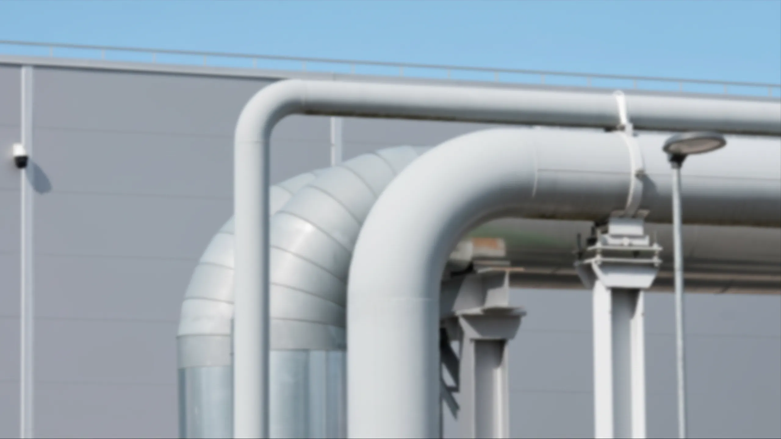 Industrial pipeline at an outdoor oil and gas facility