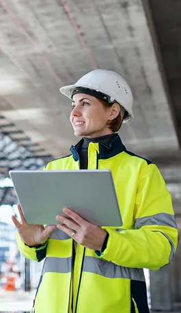 HVAC field engineer in PPE conducting a site inspection