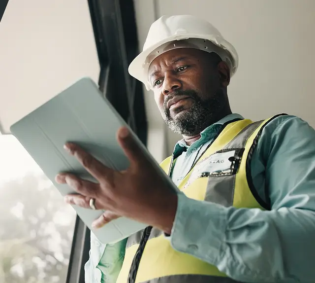 Safety inspector holding a tablet.