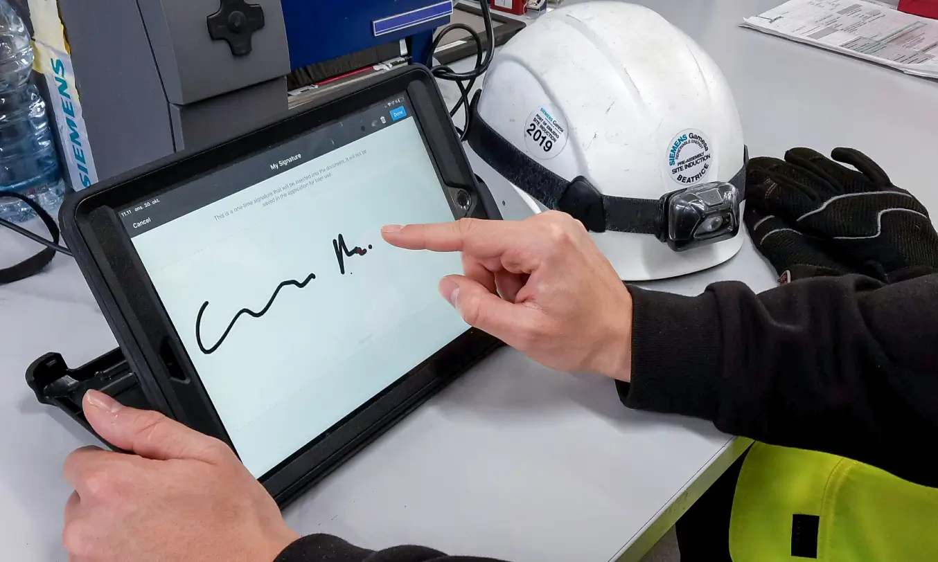 Technician filling out the form with an e-signature