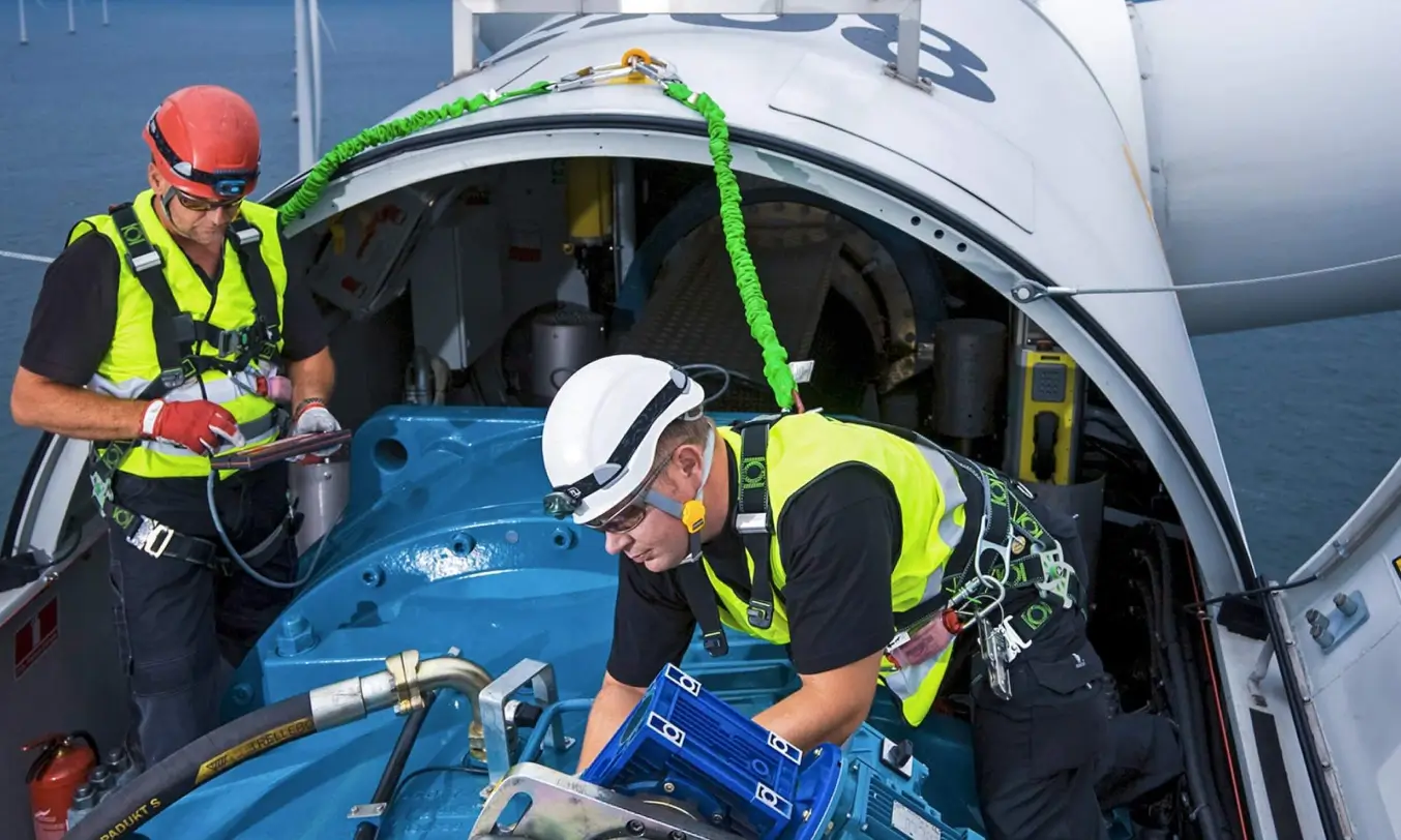 Technicians completing turbine inspection checklists on site